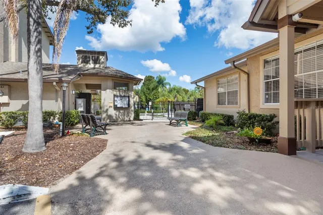 a view of a house with sitting area and garden