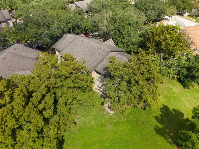an aerial view of residential house with an outdoor space