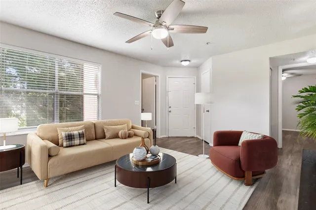 a living room with furniture and a large window
