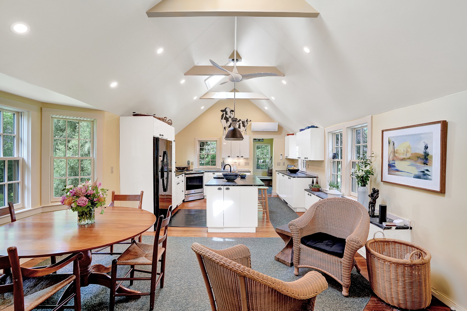 122 Old Farm Road Chilmark, MA 02535 - Photo 18 of 36 a living room with furniture a chandelier and a dining table