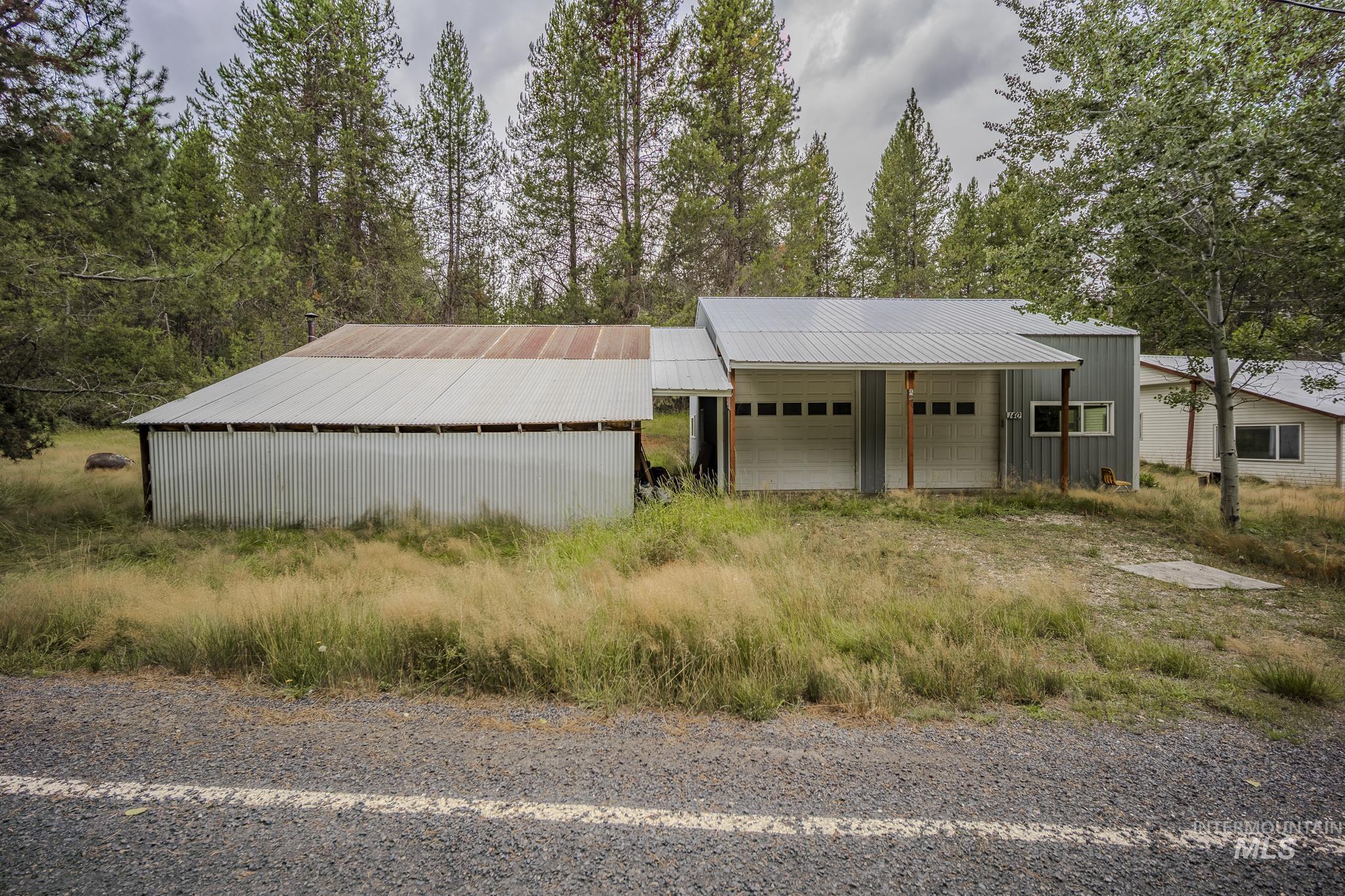 140 Ridgeway Drive Elk City, ID 83525 - Photo 33 of 47 View of front of property featuring an outdoor structure, an outbuilding, and a metal roof