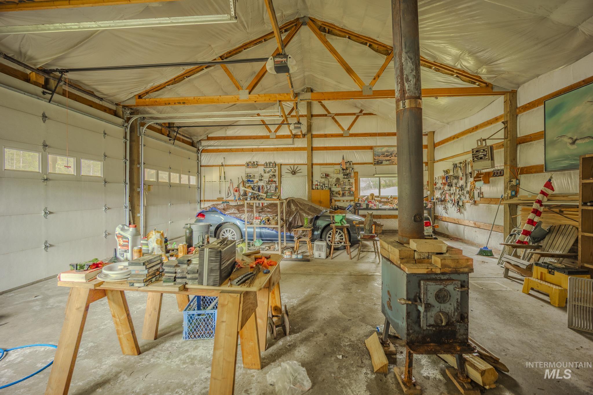 140 Ridgeway Drive Elk City, ID 83525 - Photo 38 of 47 Garage featuring metal wall and a garage door opener
