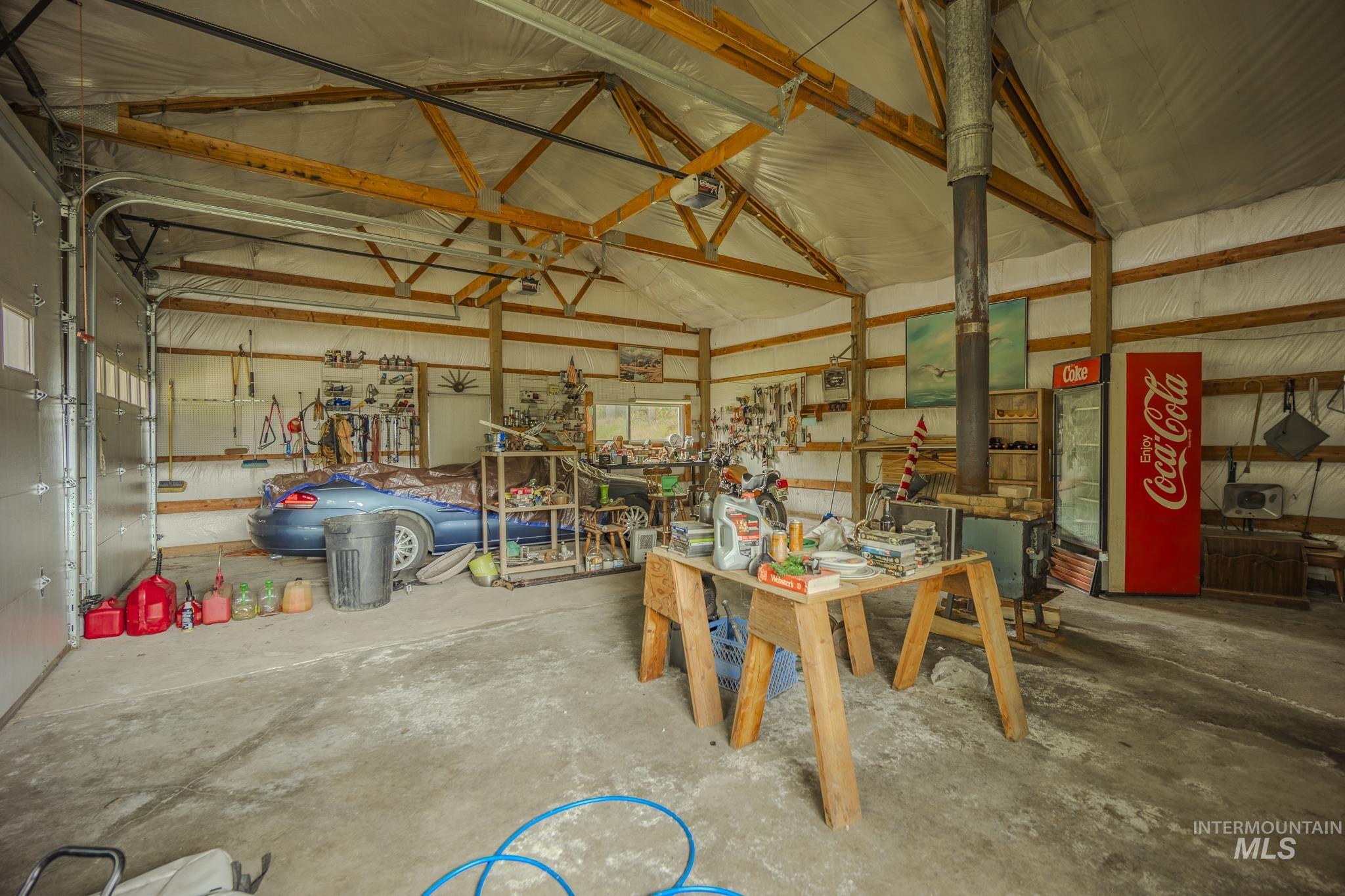 140 Ridgeway Drive Elk City, ID 83525 - Photo 40 of 47 Garage with metal wall and a workshop area