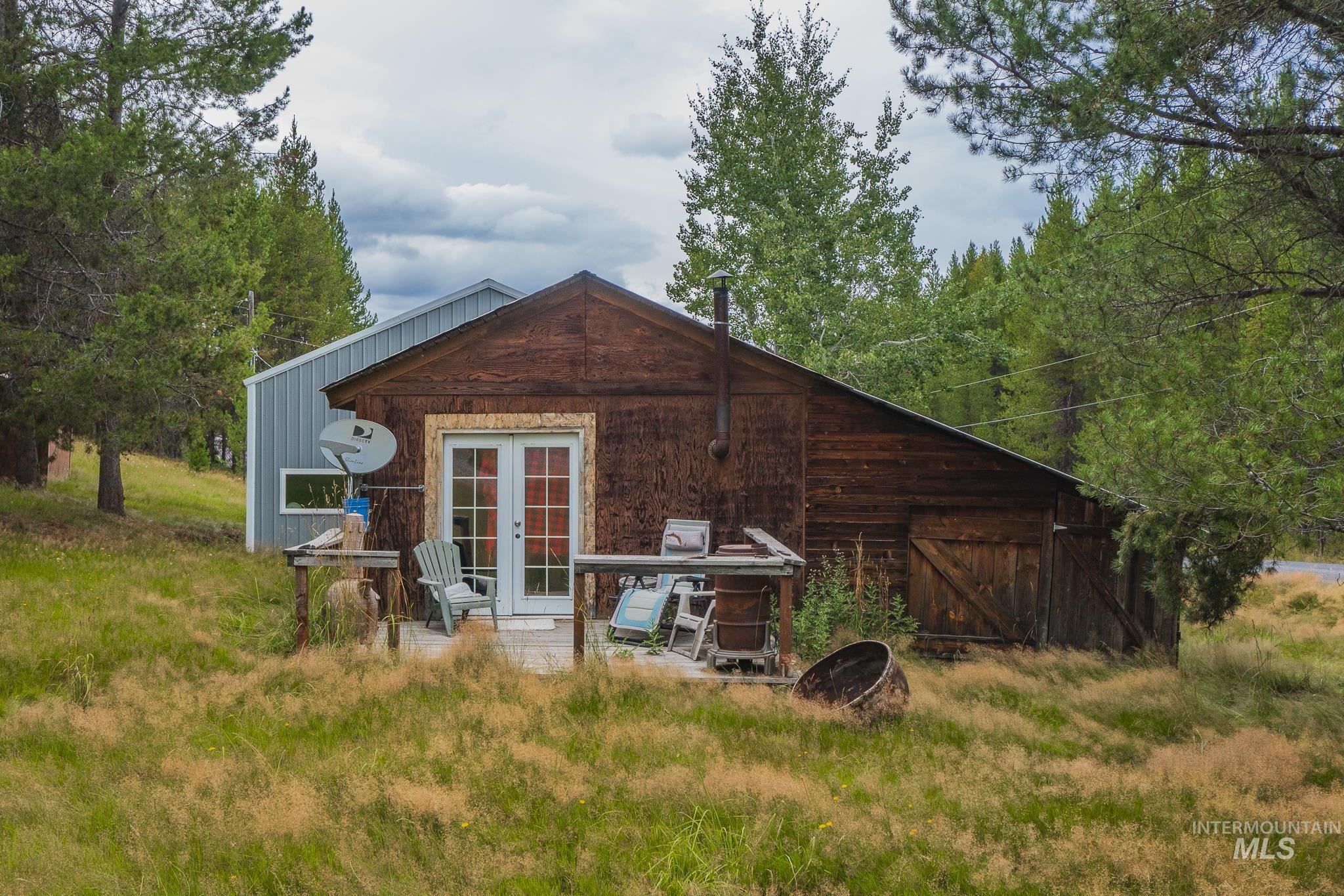 140 Ridgeway Drive Elk City, ID 83525 - Photo 41 of 47 Rear view of property with french doors, a patio area, and an outdoor structure