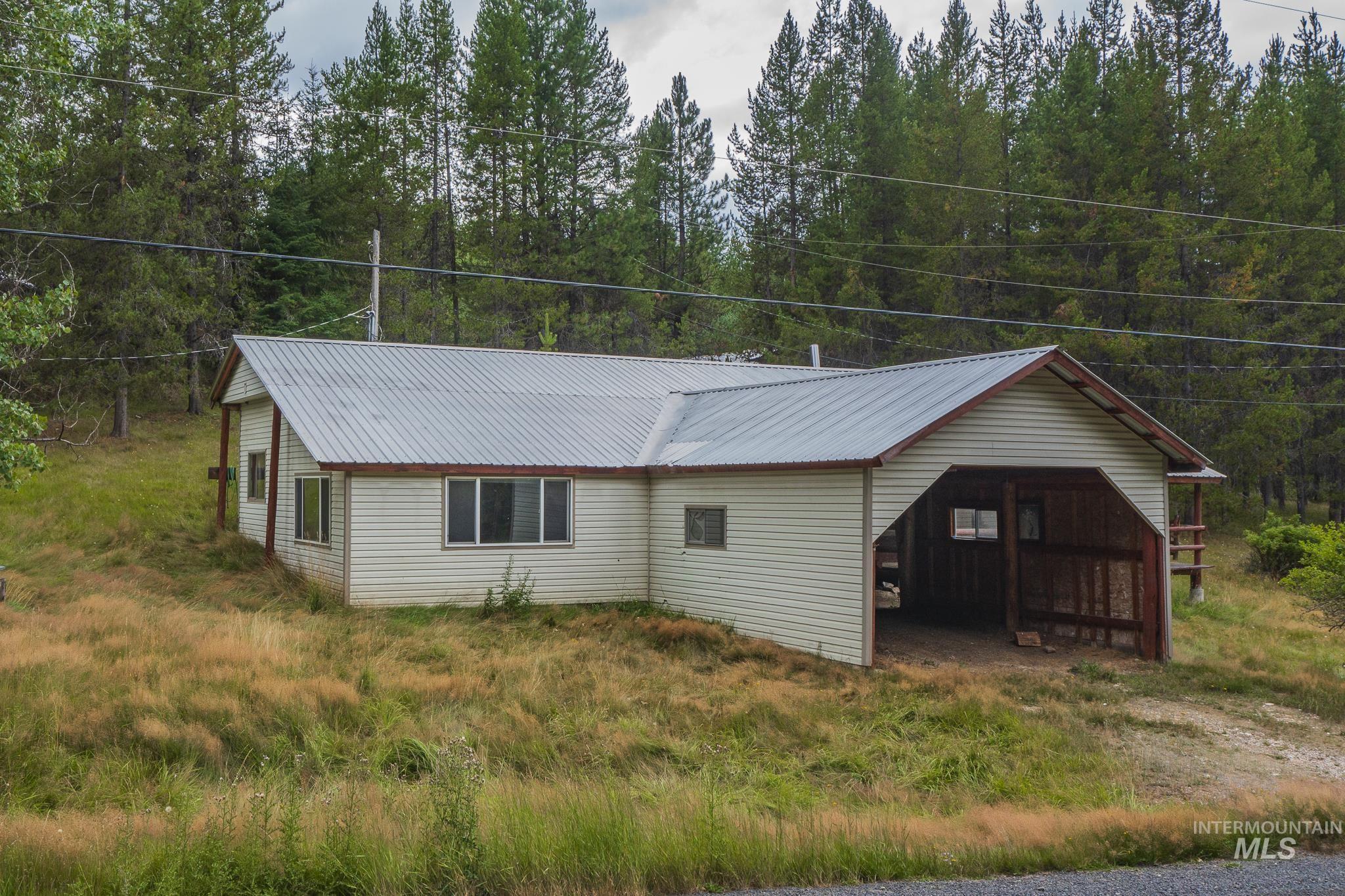 140 Ridgeway Drive Elk City, ID 83525 - Photo 10 of 47 View of property exterior with a metal roof