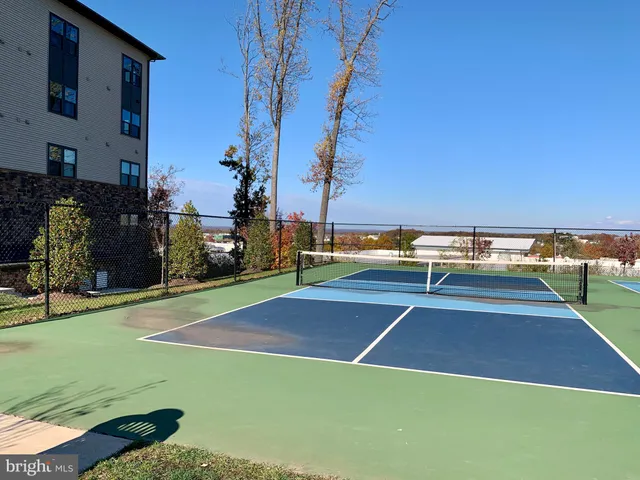 a front view of a building with a garden