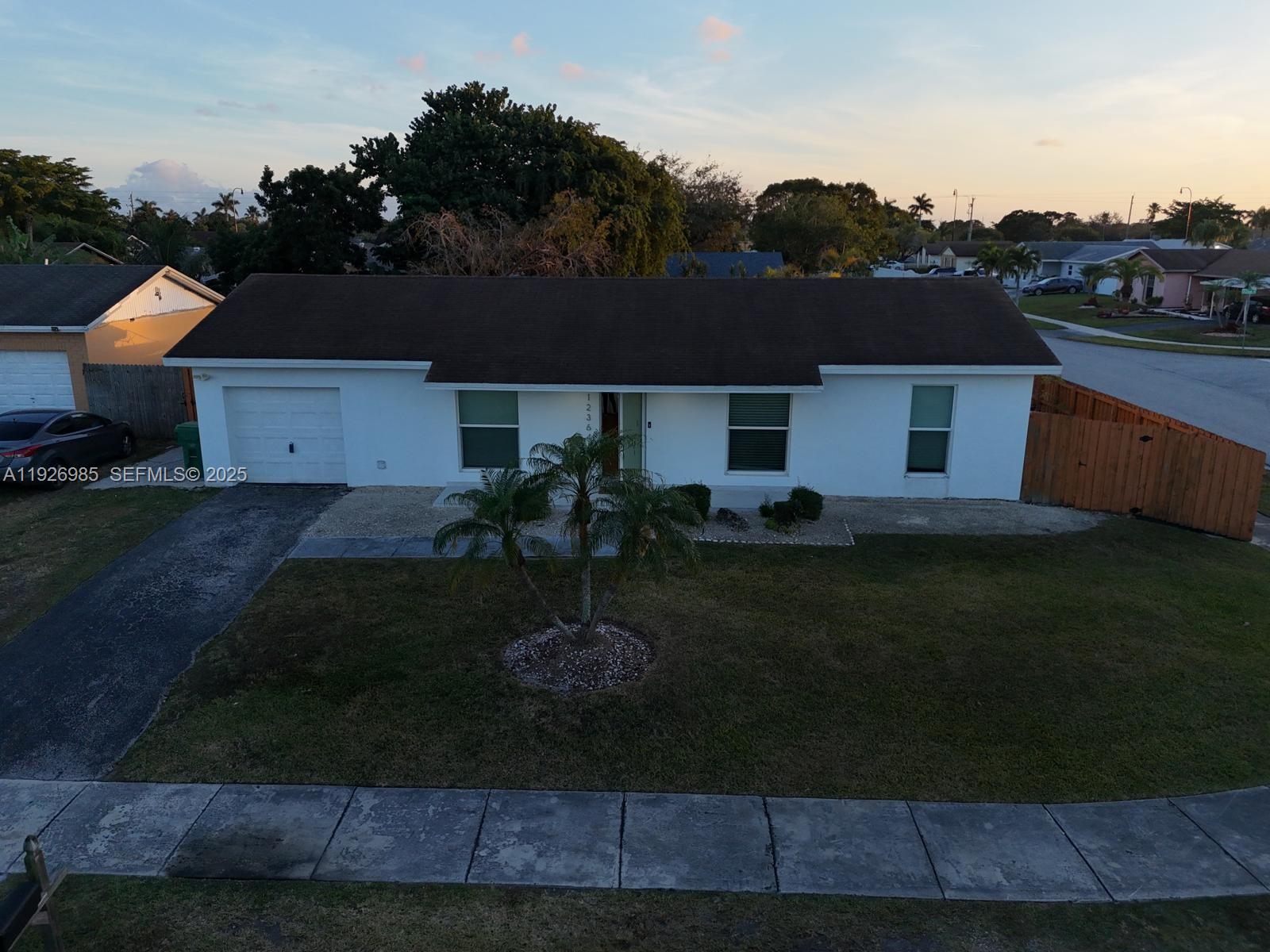 12364 Southwest 266th Terrace, Unit 12364 Homestead, FL 33032 - Photo 24 of 32 an aerial view of a house