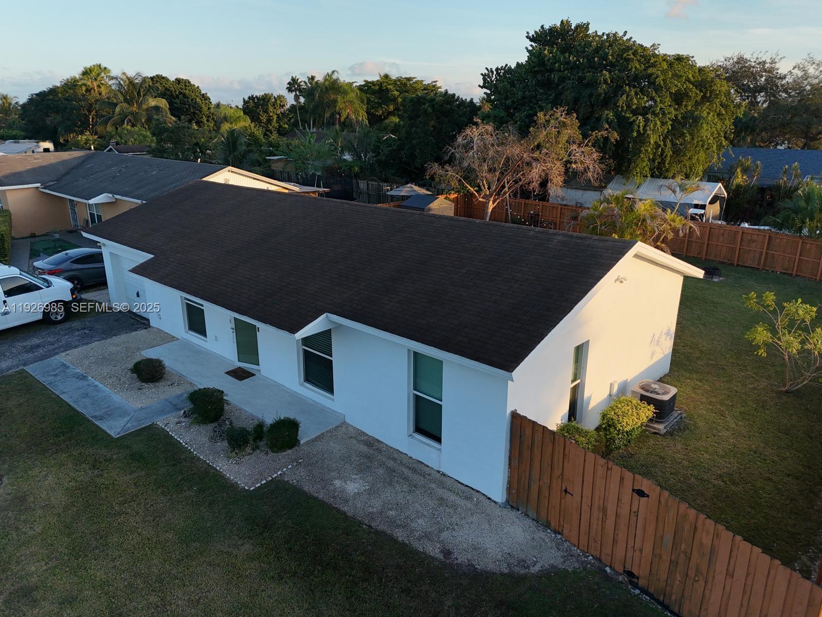 12364 Southwest 266th Terrace, Unit 12364 Homestead, FL 33032 - Photo 26 of 32 an aerial view of a house