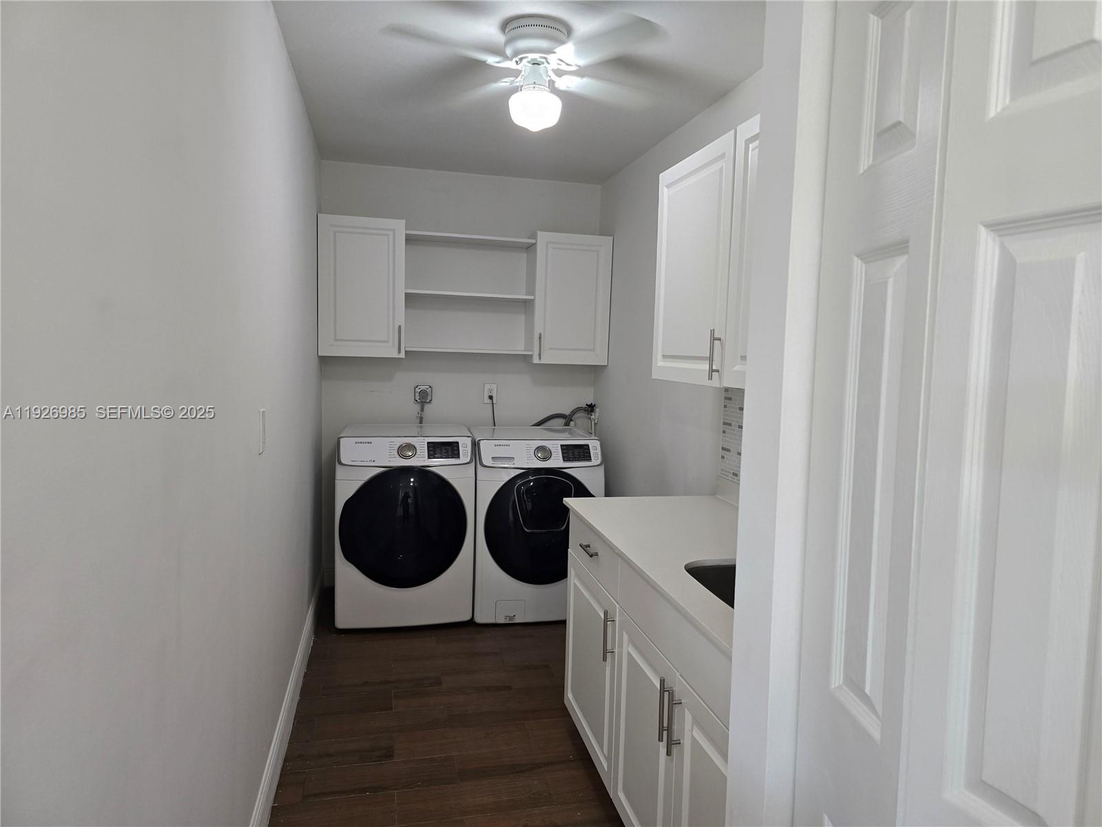 12364 Southwest 266th Terrace, Unit 12364 Homestead, FL 33032 - Photo 28 of 32 a view of a hallway with washer and dryer