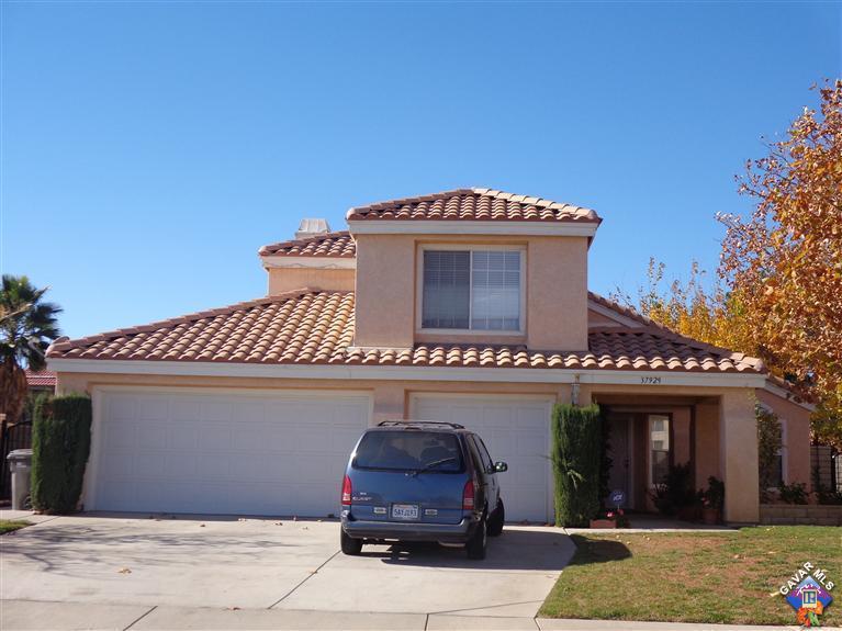 37929 Tackstem Street Palmdale, CA 93552 - Photo 1 of 8 a front view of a house with garage