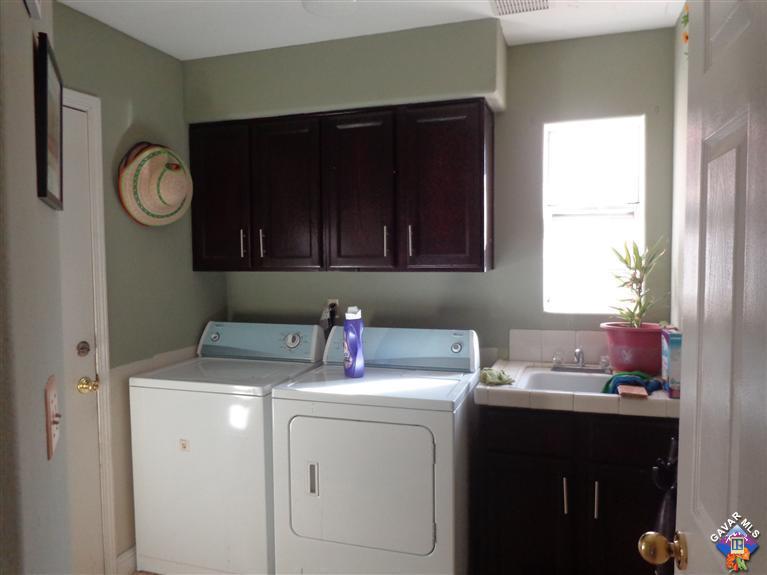 37929 Tackstem Street Palmdale, CA 93552 - Photo 5 of 8 a utility room with a sink washer and dryer