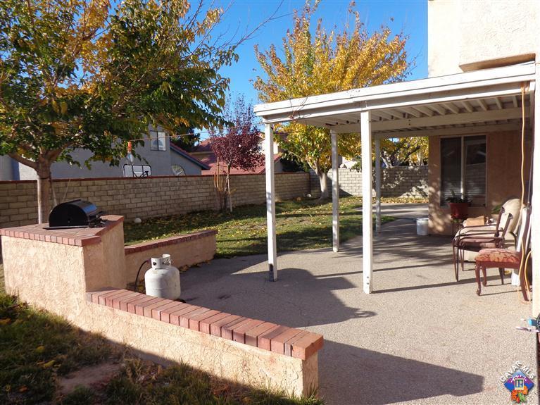 37929 Tackstem Street Palmdale, CA 93552 - Photo 7 of 8 a backyard of a house with seating space
