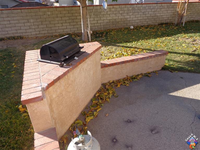 37929 Tackstem Street Palmdale, CA 93552 - Photo 8 of 8 a view of a backyard with chairs