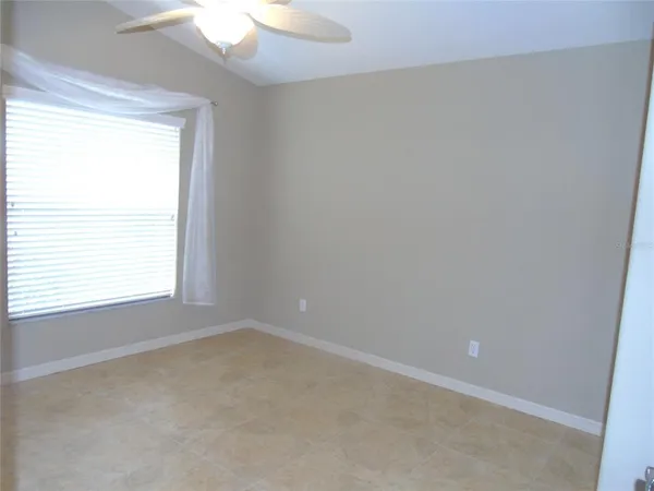 a bathroom with a granite countertop sink toilet a mirror and shower