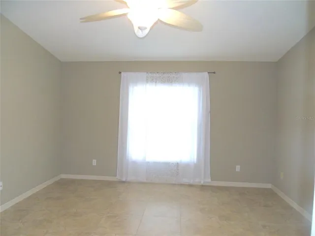 a bath tub sitting next to a white sink and vanity