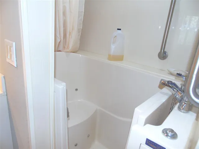 a view of a swimming pool and a yard