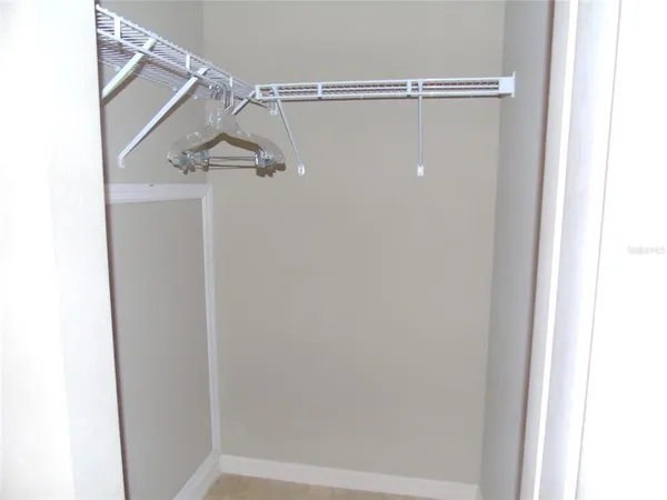 a view of a livingroom with furniture and a flat screen tv