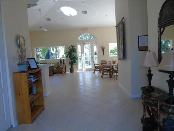 a view of a livingroom with furniture and chandelier