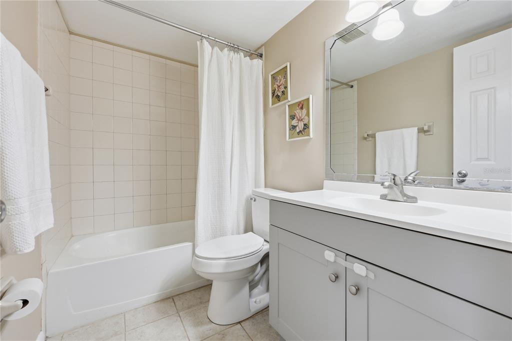 4427 Southwest 21st Lane Gainesville, FL 32607 - Photo 17 of 36 a bathroom with a sink a toilet and shower