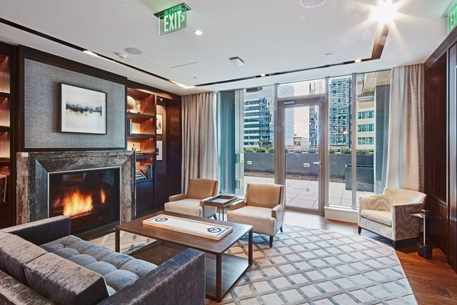 a large white kitchen with a large window
