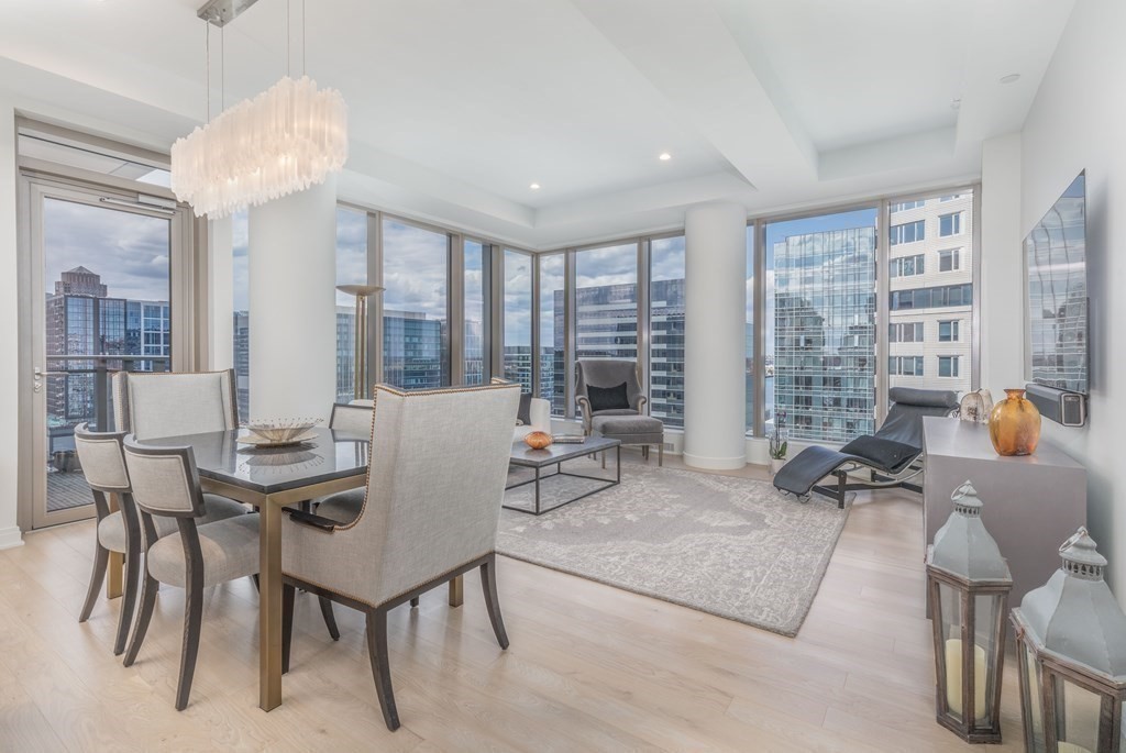 133 Seaport Boulevard, Unit 1908 Boston, MA 02210 - Photo 4 of 34 a view of a livingroom with furniture and window