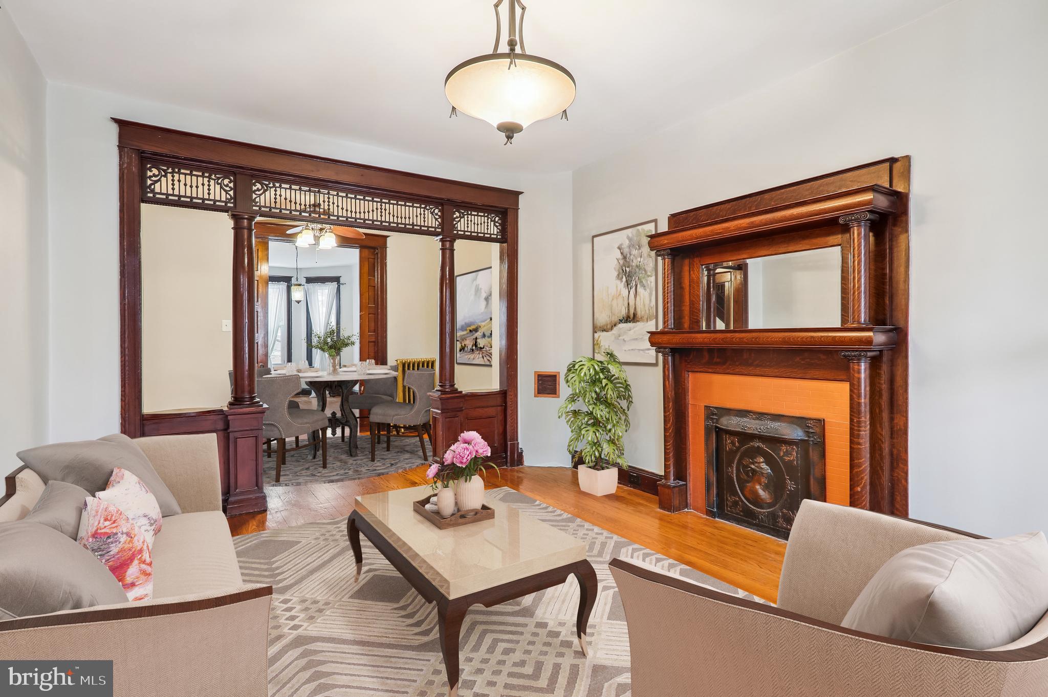 a living room with furniture and a fireplace