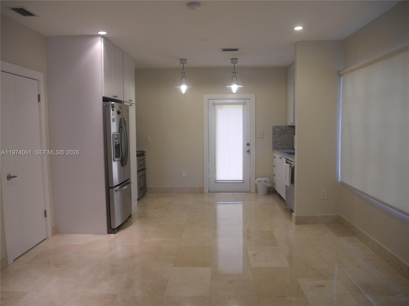 1720 Southwest 22nd Terrace Miami, FL 33145 - Photo 12 of 19 an empty room with closet and a window