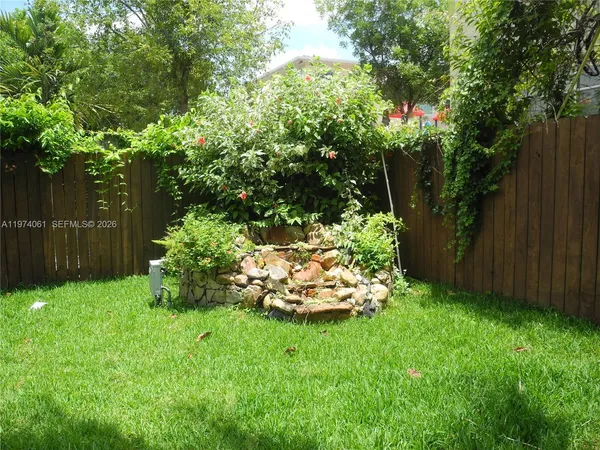 a view of backyard with green space