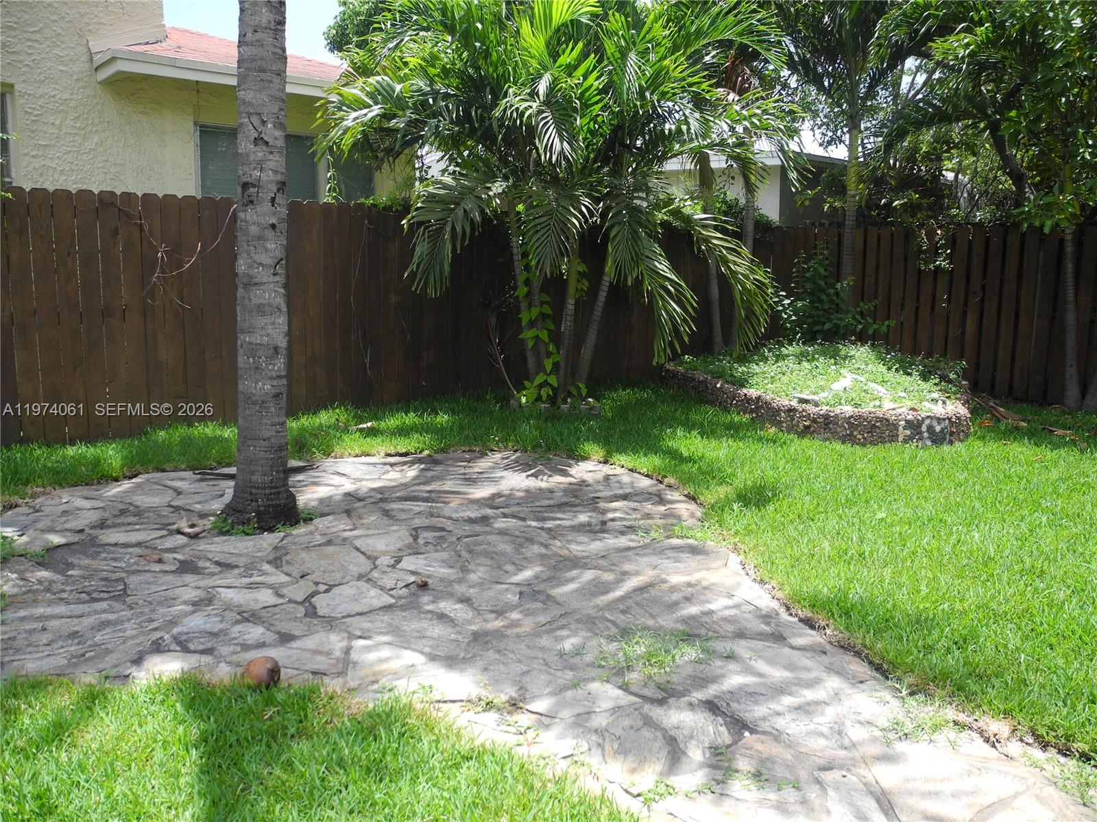 1720 Southwest 22nd Terrace Miami, FL 33145 - Photo 18 of 19 a view of backyard with green space