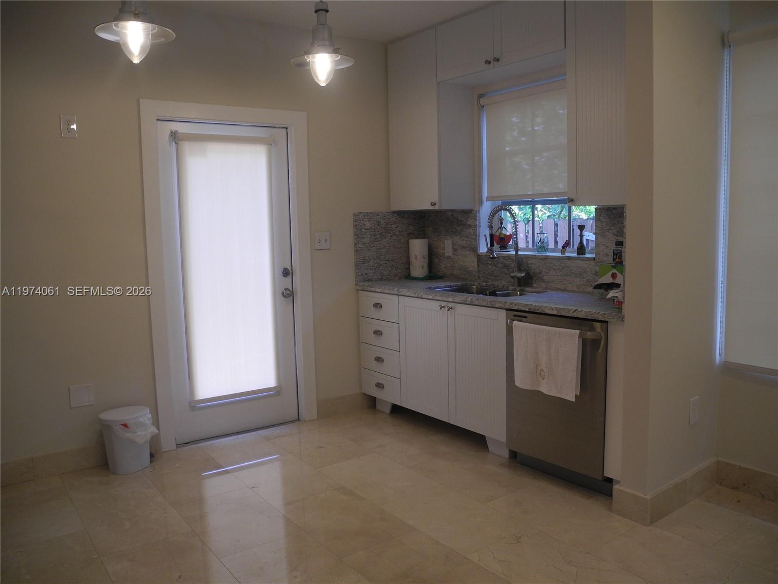 1720 Southwest 22nd Terrace Miami, FL 33145 - Photo 7 of 19 a kitchen with stainless steel appliances a sink and a microwave