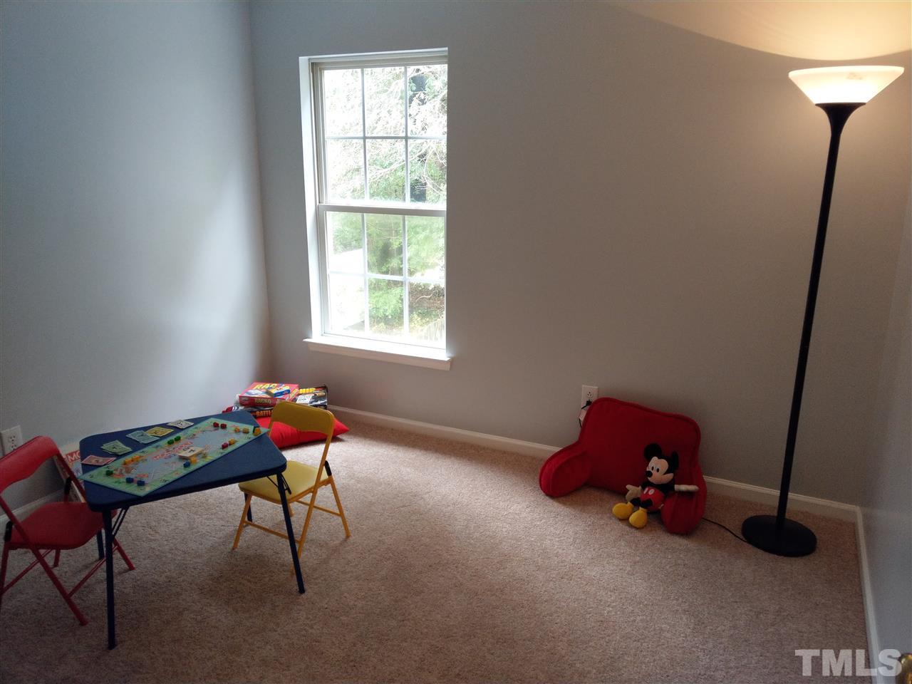 5619 Marthonna Way Raleigh, NC 27616 - Photo 22 of 26 a room with toys and a window