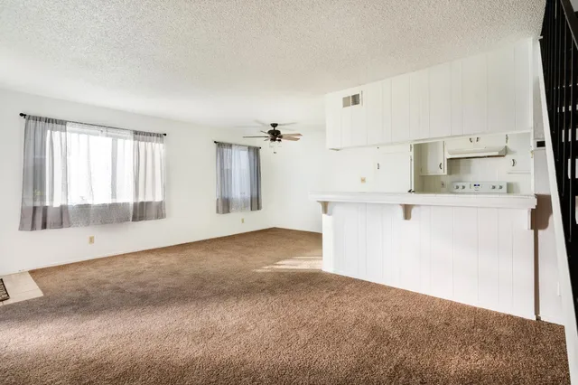 a view of a kitchen with a sink