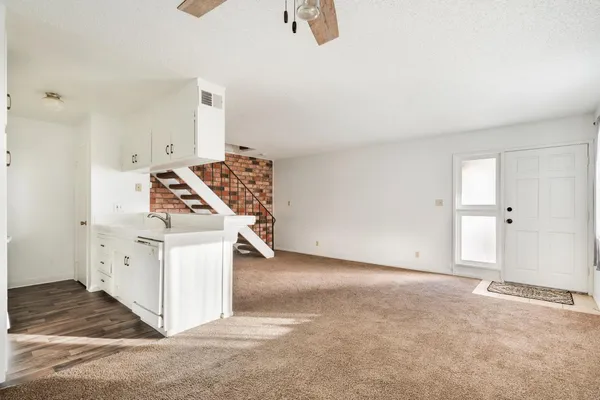 an empty room with windows and pillars