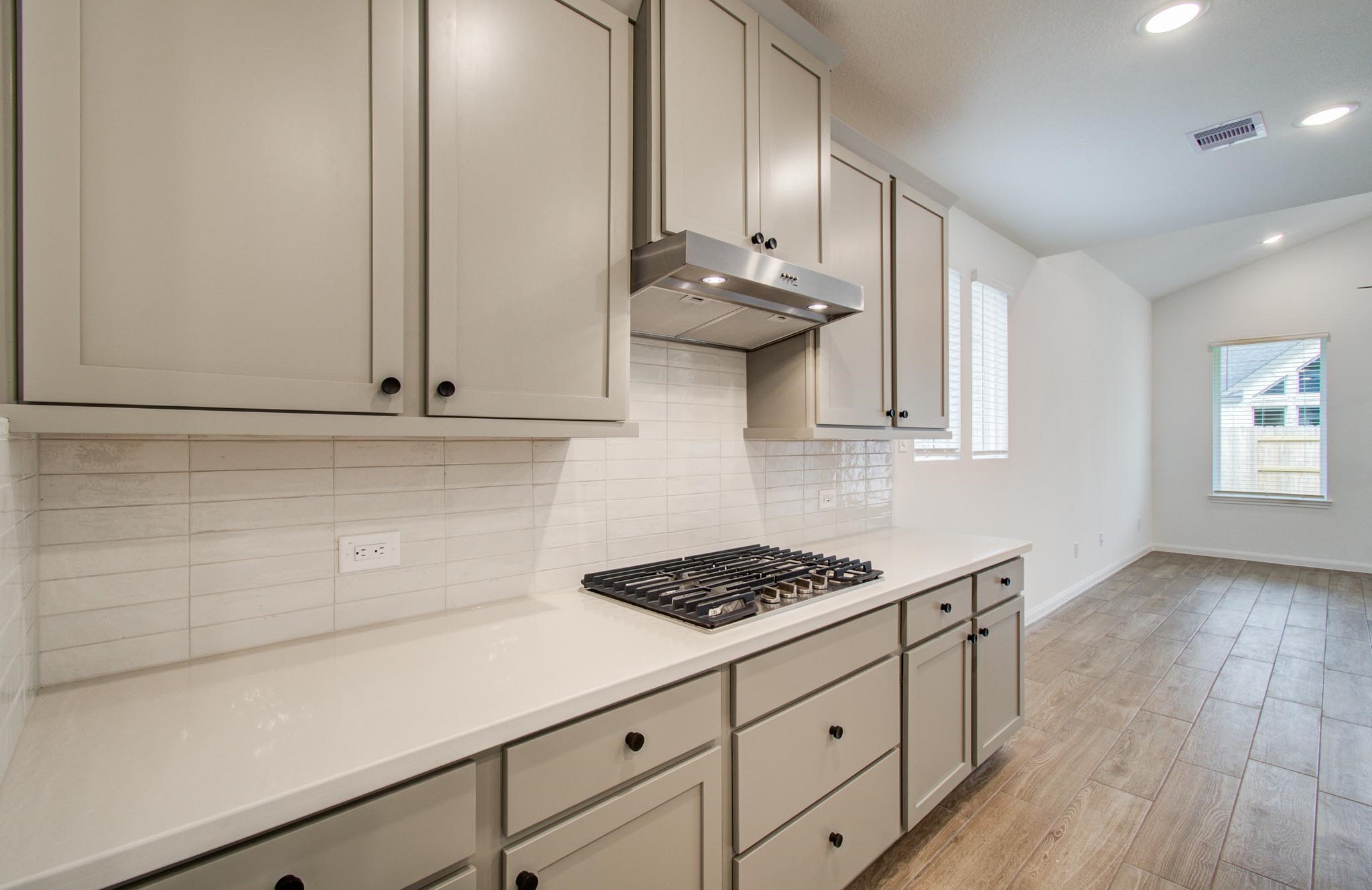 7231 Yarrow Blossom Court Katy, TX 77493 - Photo 17 of 49 a kitchen with stainless steel appliances a sink dishwasher stove and cabinets