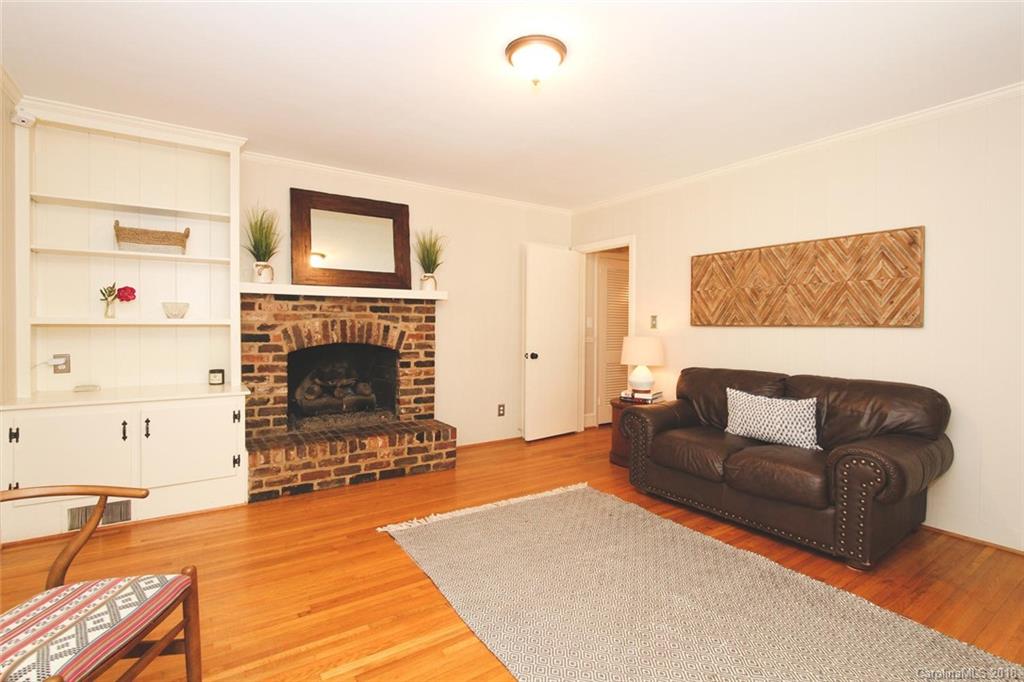 527 Ashworth Road Charlotte, NC 28211 - Photo 14 of 34 a living room with furniture and a fireplace