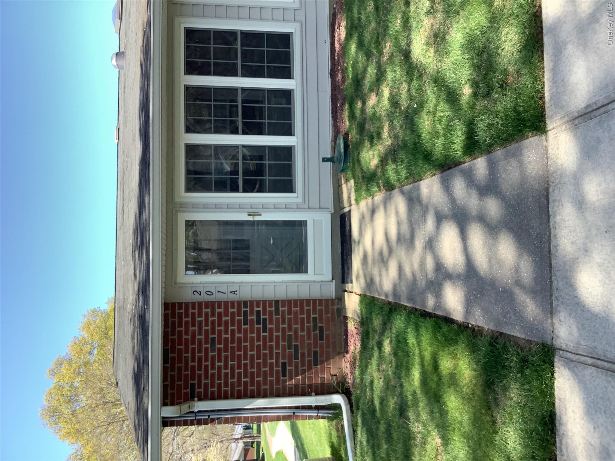 201 Newcastle Court, Unit A Ridge, NY 11961 - Photo 1 of 8