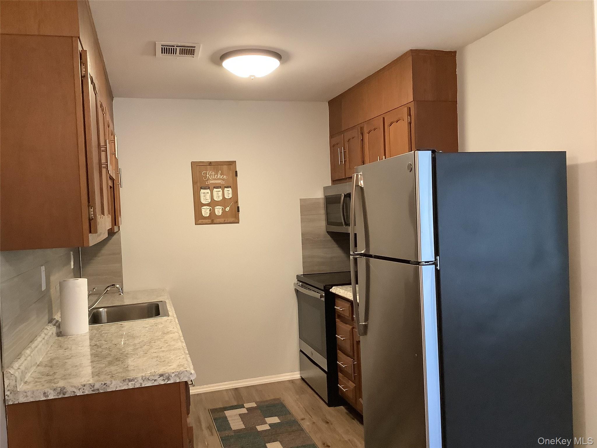 201 Newcastle Court, Unit A Ridge, NY 11961 - Photo 3 of 8