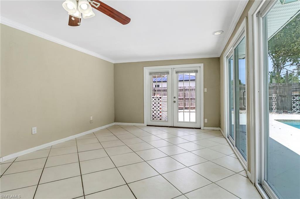 189 Mentor Drive Naples, FL 34110 - Photo 14 of 25 a view of an empty room and window