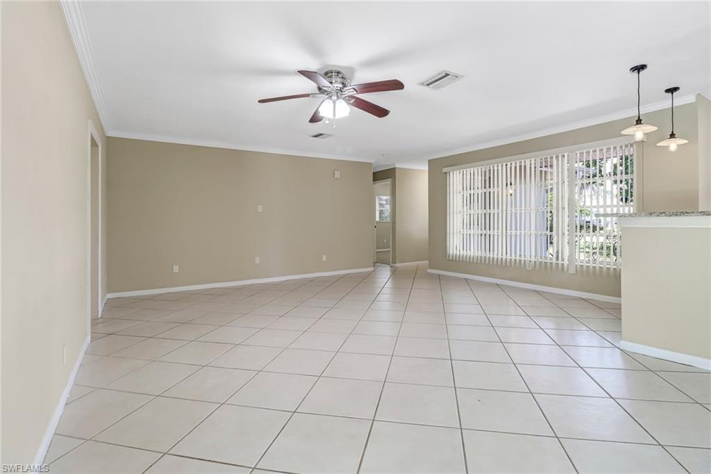 189 Mentor Drive Naples, FL 34110 - Photo 6 of 25 a view of an empty room with a window
