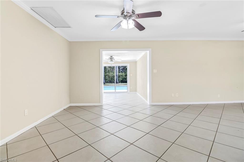 189 Mentor Drive Naples, FL 34110 - Photo 8 of 25 a view of an empty room and window