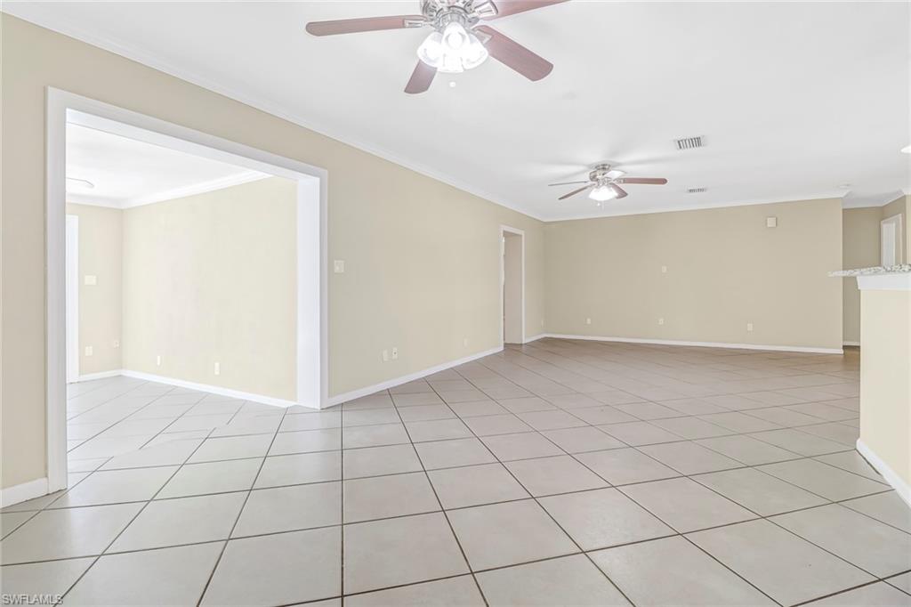 189 Mentor Drive Naples, FL 34110 - Photo 9 of 25 a view of an empty room with a ceiling fan