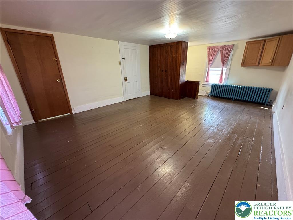868 Catawissa Road Tamaqua, PA 18252 - Photo 41 of 67 Hardwood floors and a bright window create an inviting atmosphere.