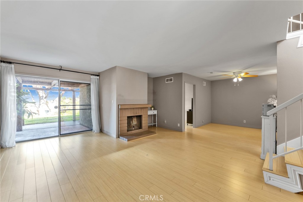 16211 Sierra Ridge Way Hacienda Heights, CA 91745 - Photo 12 of 46 a view of an empty room with a fireplace and a window