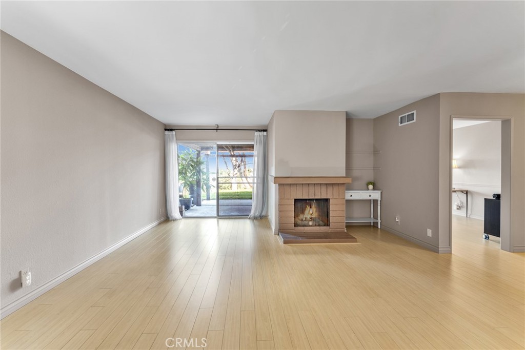 16211 Sierra Ridge Way Hacienda Heights, CA 91745 - Photo 14 of 46 a view of an empty room with a fireplace and window
