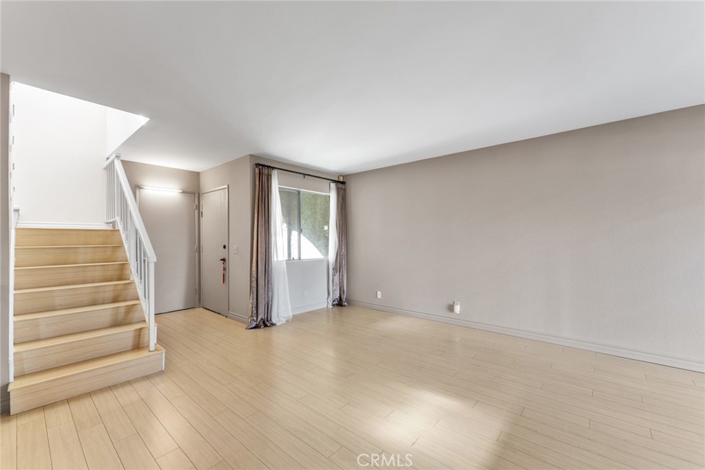 16211 Sierra Ridge Way Hacienda Heights, CA 91745 - Photo 15 of 46 an empty room with wooden floor and windows