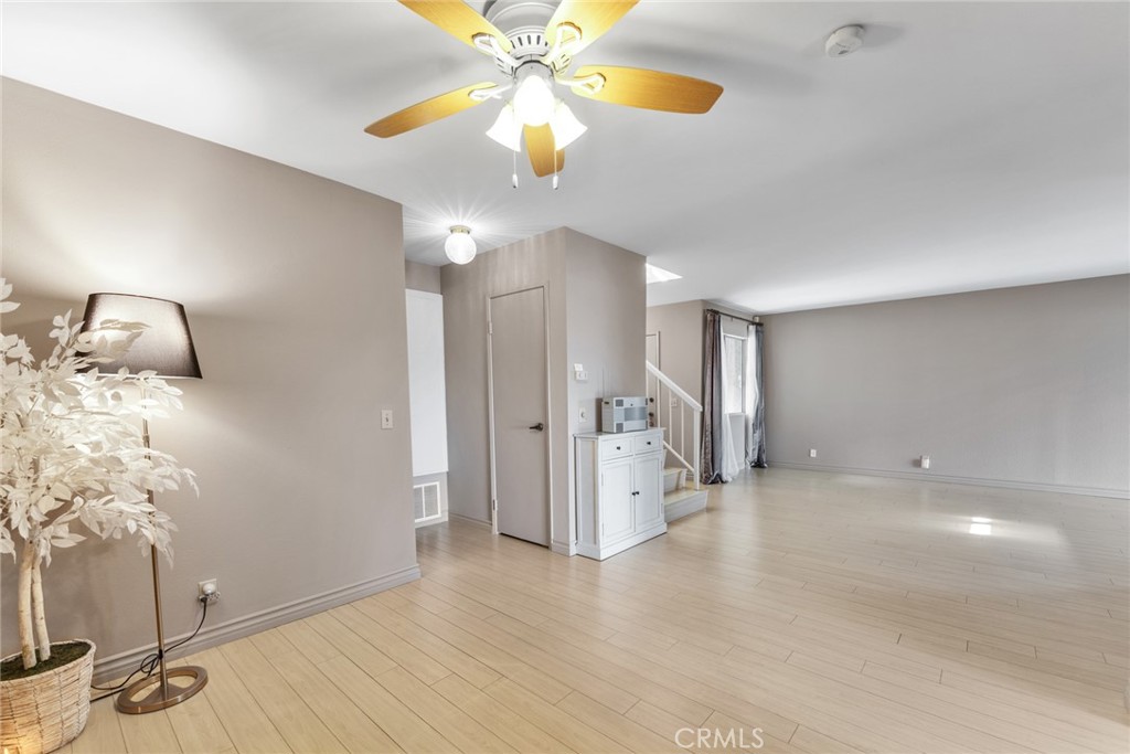 16211 Sierra Ridge Way Hacienda Heights, CA 91745 - Photo 16 of 46 a view of an empty room with a chandelier fan