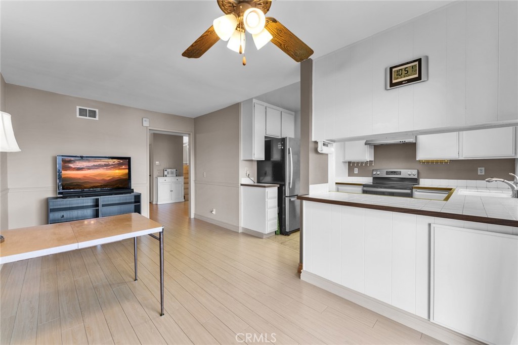 16211 Sierra Ridge Way Hacienda Heights, CA 91745 - Photo 21 of 46 a kitchen with stainless steel appliances granite countertop a refrigerator and a stove top oven