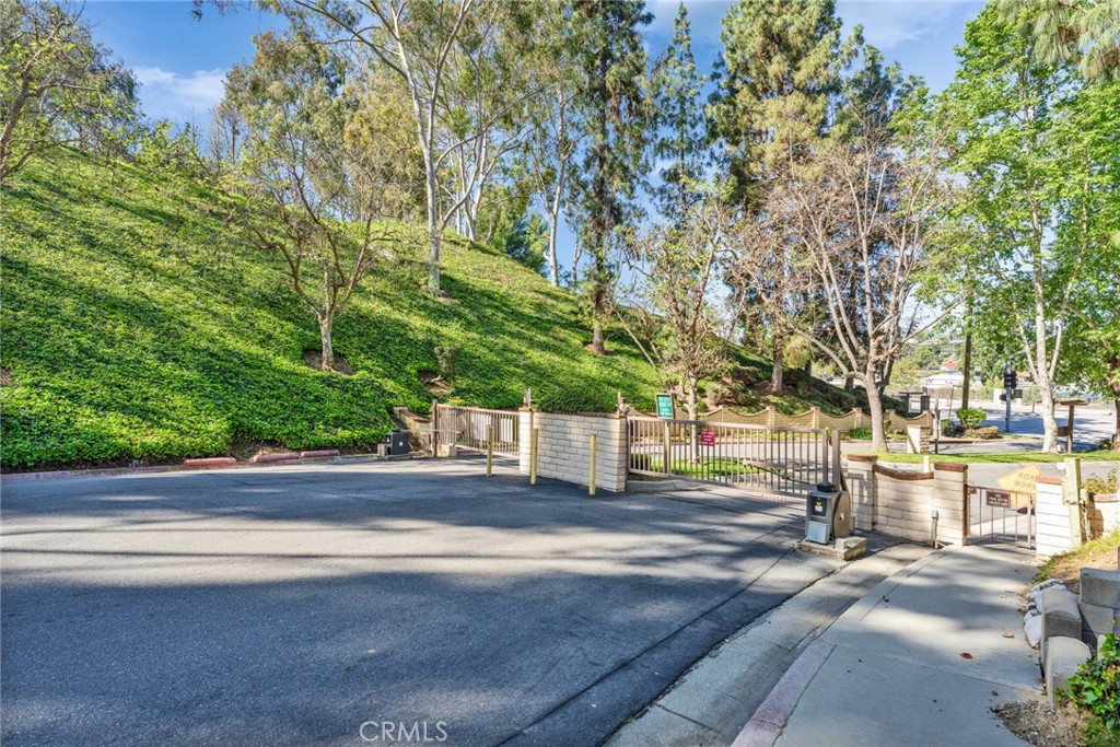 16211 Sierra Ridge Way Hacienda Heights, CA 91745 - Photo 4 of 46 a view of city street with large trees