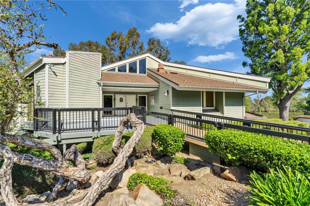 16211 Sierra Ridge Way Hacienda Heights, CA 91745 - Photo 6 of 46 a front view of a house with a yard and outdoor seating