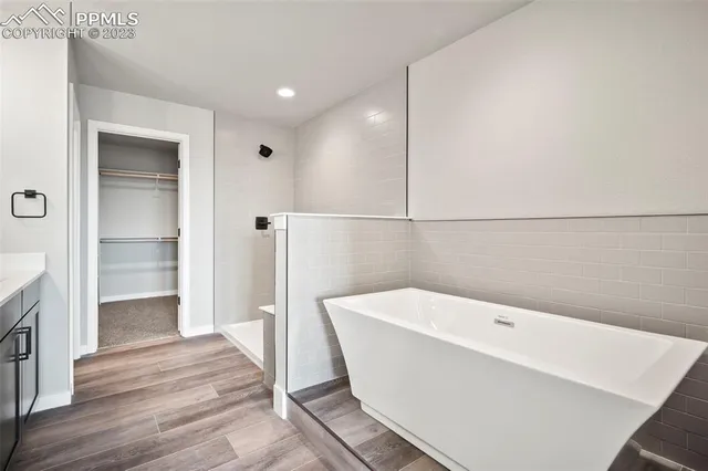 a bathroom with a bathtub and shower